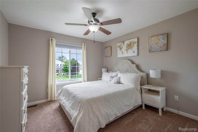 13109 River Rock Pass, Linden, MI 48451 - bedroom featuring light carpet, baseboards, and ceiling fan