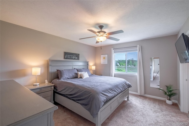 13109 River Rock Pass, Linden, MI 48451 - bedroom with light carpet, baseboards, and ceiling fan