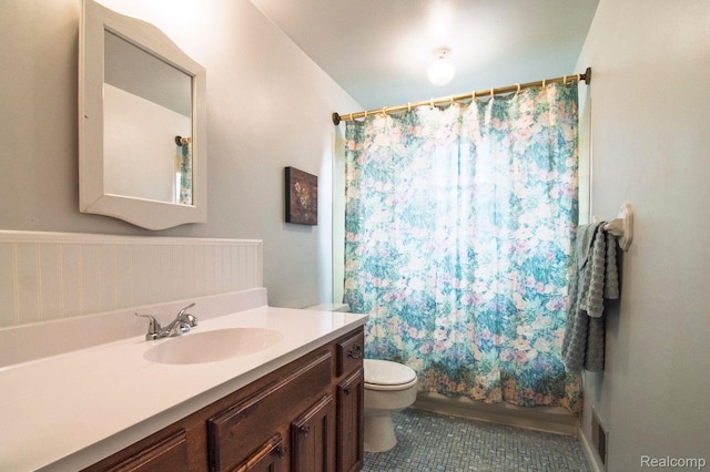 3266 Benstein Rd, Commerce Twp, MI 48382 - full bath featuring toilet, vanity, and tile patterned flooring