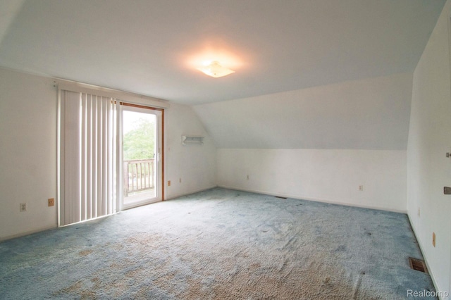 3266 Benstein Rd, Commerce Twp, MI 48382 - additional living space featuring carpet floors and vaulted ceiling