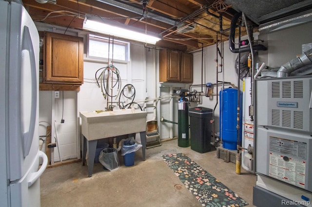 3266 Benstein Rd, Commerce Twp, MI 48382 - below grade area with freestanding refrigerator, a water pressure tank, a water softener, and a sink
