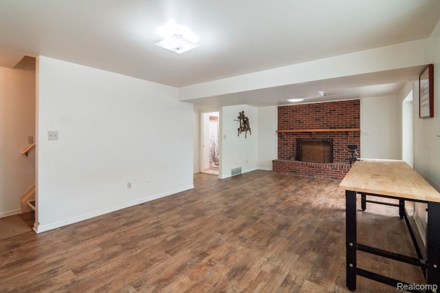 3266 Benstein Rd, Commerce Twp, MI 48382 - unfurnished living room with a fireplace, wood finished floors, stairs, and baseboards