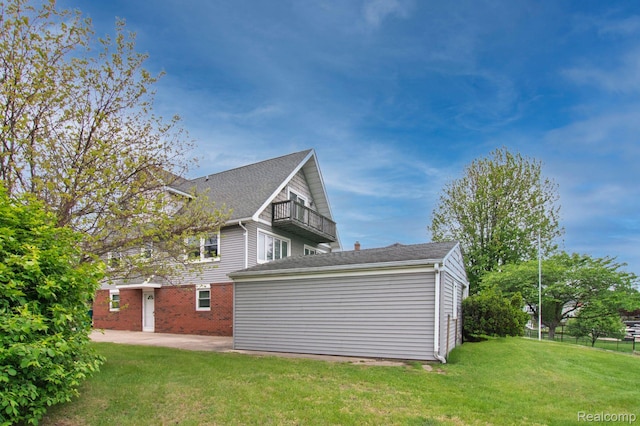 3266 Benstein Rd, Commerce Twp, MI 48382 - view of property exterior with a balcony, a patio, and roof with shingles