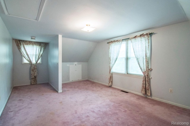 3266 Benstein Rd, Commerce Twp, MI 48382 - additional living space featuring light carpet, lofted ceiling, and baseboards