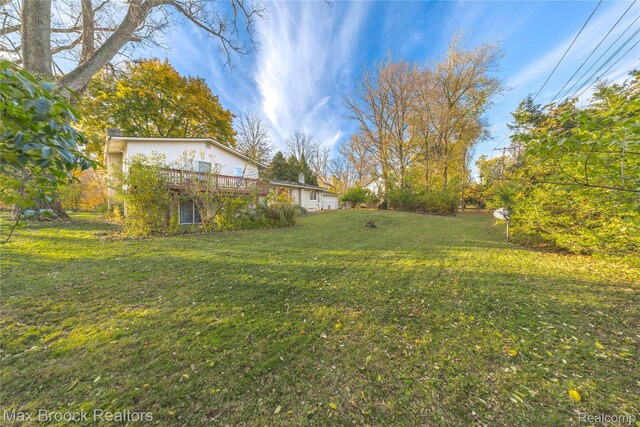 28290 Inkster Rd, Southfield, MI 48034 - view of green lawn with a wooden deck