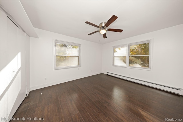 28290 Inkster Rd, Southfield, MI 48034 - unfurnished room featuring a baseboard heating unit, ceiling fan, wood finished floors, and baseboards