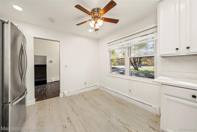 28290 Inkster Rd, Southfield, MI 48034 - unfurnished dining area with a ceiling fan, recessed lighting, wood finished floors, baseboard heating, and baseboards