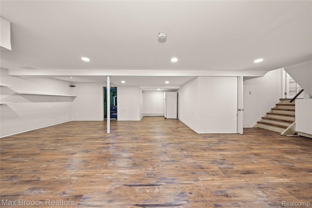 28290 Inkster Rd, Southfield, MI 48034 - finished below grade area with stairway, wood finished floors, recessed lighting, and baseboard heating