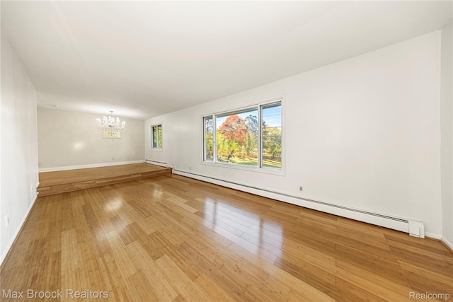 28290 Inkster Rd, Southfield, MI 48034 - unfurnished room featuring a baseboard radiator, a chandelier, light wood-type flooring, baseboards, and a baseboard heating unit
