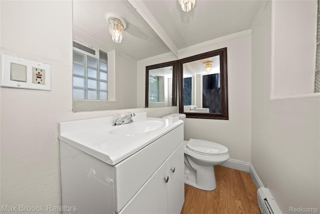 28290 Inkster Rd, Southfield, MI 48034 - half bathroom with a baseboard radiator, toilet, vanity, wood finished floors, and ornamental molding