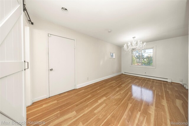 28290 Inkster Rd, Southfield, MI 48034 - unfurnished room with a baseboard heating unit, light wood finished floors, a chandelier, and baseboards
