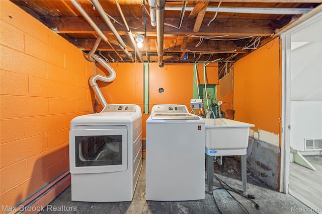 28290 Inkster Rd, Southfield, MI 48034 - washroom with washer and dryer and concrete block wall