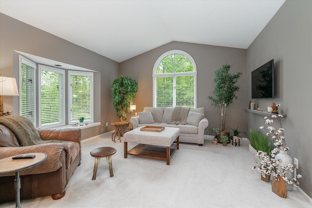 5400 Laura Dr, Shelbyville, MI 49344 - living area featuring carpet floors, vaulted ceiling, and baseboards