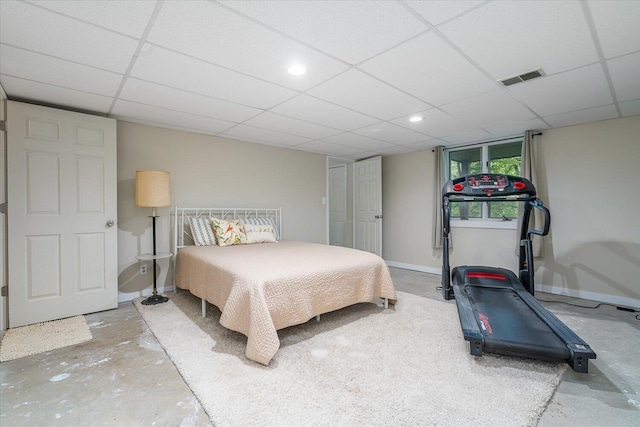 5400 Laura Dr, Shelbyville, MI 49344 - bedroom with concrete floors, a paneled ceiling, and baseboards