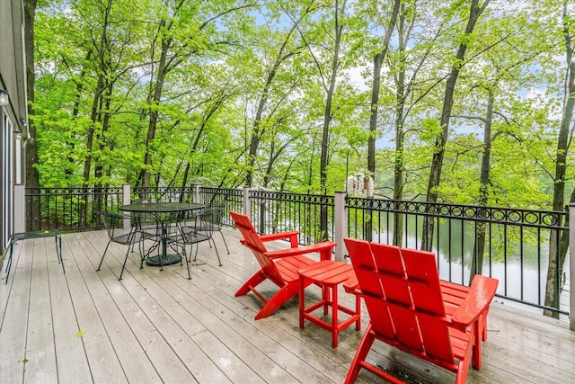 5400 Laura Dr, Shelbyville, MI 49344 - deck featuring outdoor dining space, a water view, and view of scattered trees