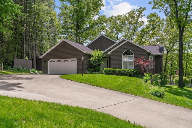 5400 Laura Dr, Shelbyville, MI 49344 - ranch-style house with an attached garage, driveway, and a front yard