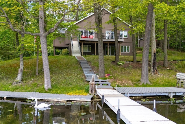 5400 Laura Dr, Shelbyville, MI 49344 - dock area with stairs, a yard, and a deck with water view