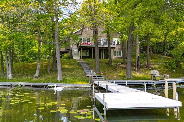 5400 Laura Dr, Shelbyville, MI 49344 - dock area featuring stairs, a lawn, and a water view
