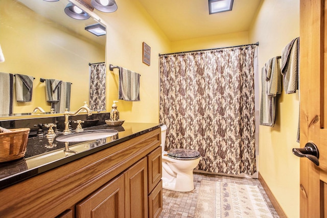 3050 Thorpe Dr, Delton, MI 49046 - bathroom featuring vanity, toilet, a shower with curtain, and tile patterned flooring