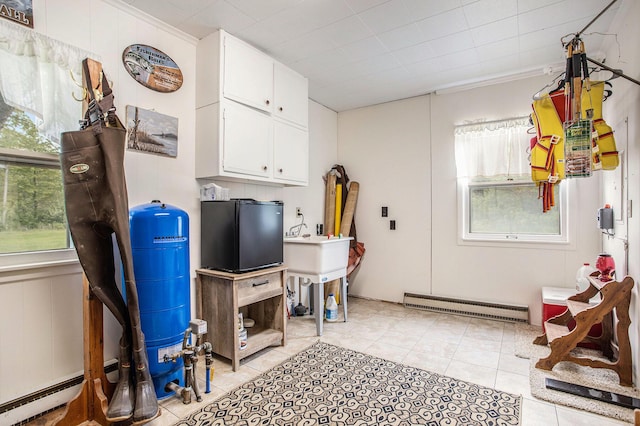 3050 Thorpe Dr, Delton, MI 49046 - misc room featuring baseboard heating and light tile patterned floors