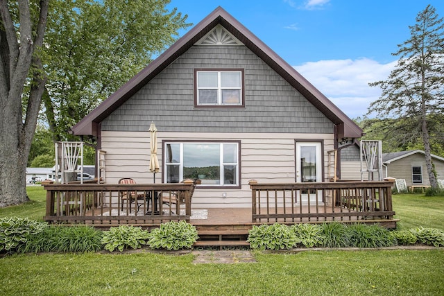 3050 Thorpe Dr, Delton, MI 49046 - back of house with a wooden deck and a lawn