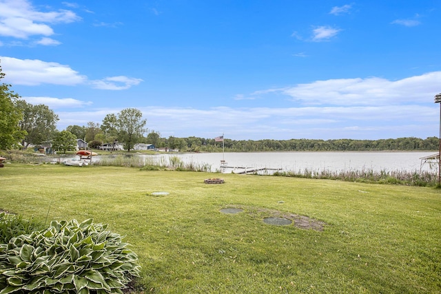 3050 Thorpe Dr, Delton, MI 49046 - view of grassy yard featuring a water view and an outdoor fire pit