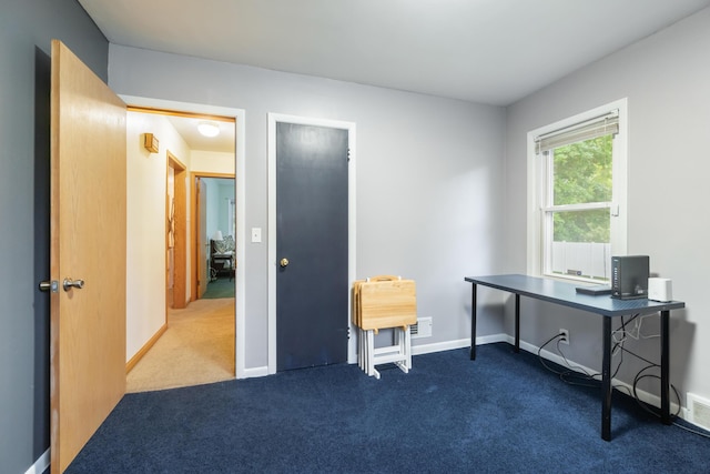 210 E Palmer Ave, Jackson, MI 49203 - office featuring dark colored carpet and baseboards