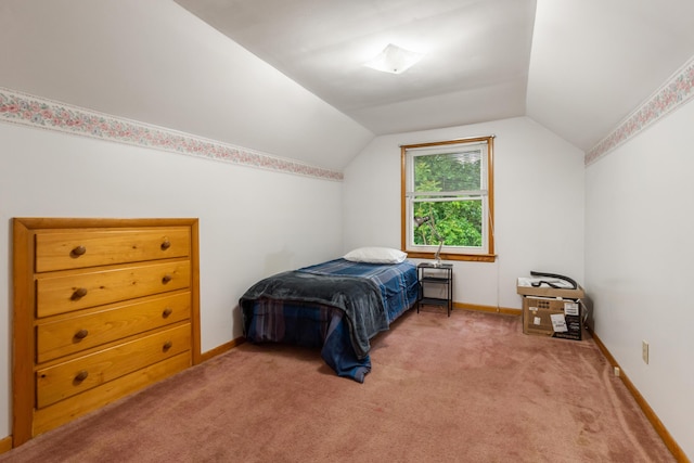 210 E Palmer Ave, Jackson, MI 49203 - carpeted bedroom with vaulted ceiling and baseboards