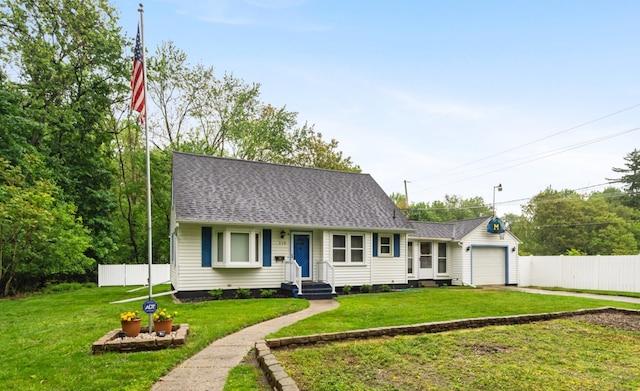 210 E Palmer Ave, Jackson, MI 49203 - view of front facade featuring an attached garage, driveway, and a shingled roof