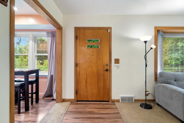 210 E Palmer Ave, Jackson, MI 49203 - foyer entrance with wood finished floors and baseboards