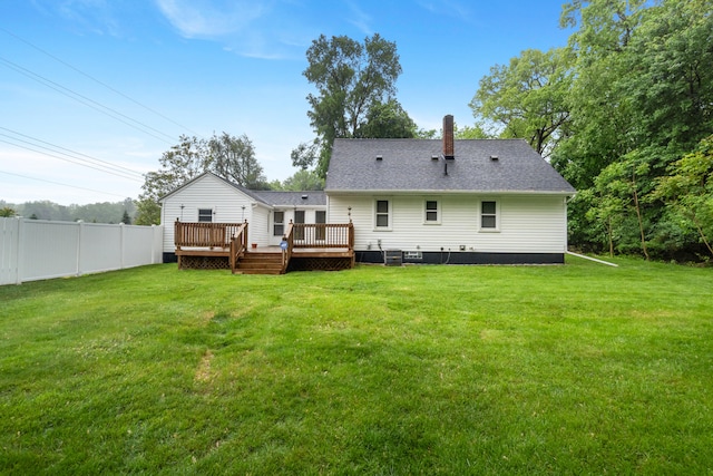 210 E Palmer Ave, Jackson, MI 49203 - back of house featuring a deck, a chimney, and roof with shingles