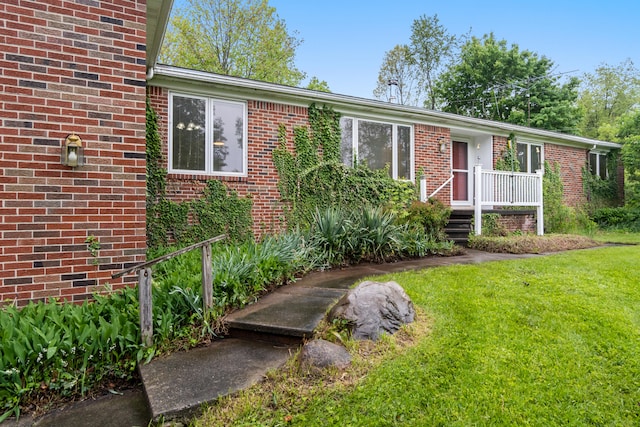 2141 N Parker Rd, Dexter, MI 48130 - ranch-style house featuring a front lawn and brick siding