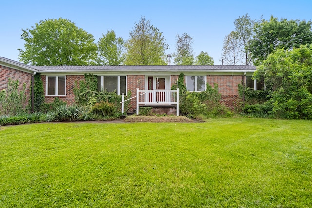 2141 N Parker Rd, Dexter, MI 48130 - ranch-style house featuring a front yard and brick siding