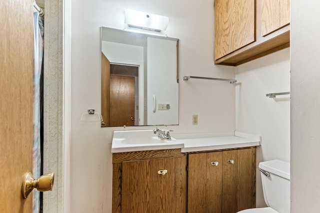 2141 N Parker Rd, Dexter, MI 48130 - bathroom featuring vanity, toilet, and a wall mounted air conditioner