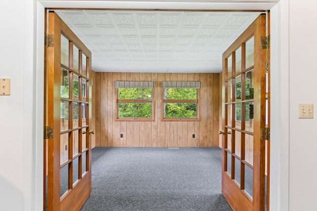 2141 N Parker Rd, Dexter, MI 48130 - carpeted spare room with french doors, wooden walls, and an ornate ceiling