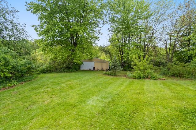 2141 N Parker Rd, Dexter, MI 48130 - view of green lawn featuring an outbuilding and an outdoor structure