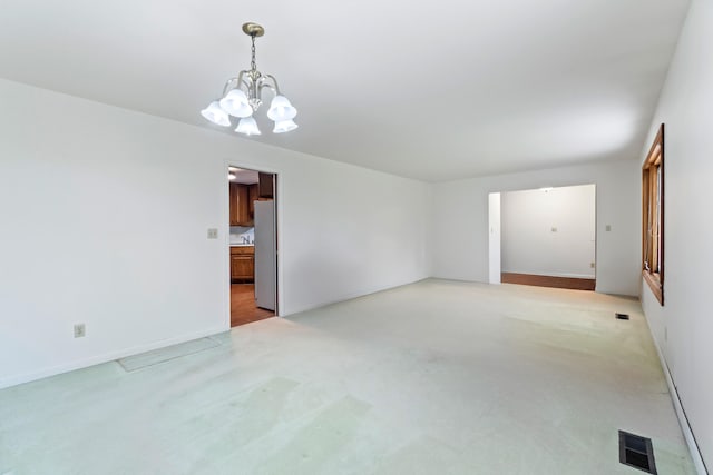 2141 N Parker Rd, Dexter, MI 48130 - unfurnished room featuring a chandelier, light colored carpet, and baseboards