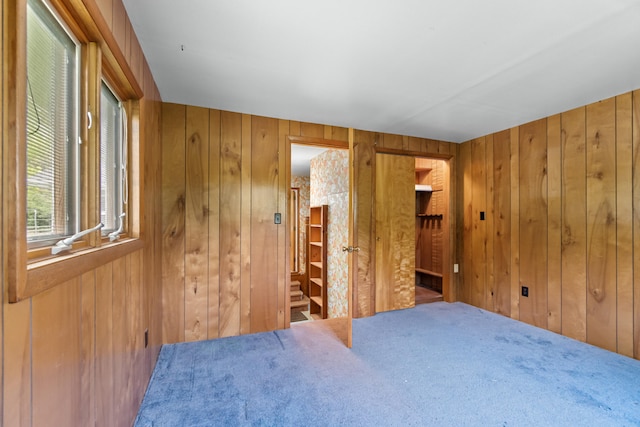 2141 N Parker Rd, Dexter, MI 48130 - carpeted bedroom featuring wood walls
