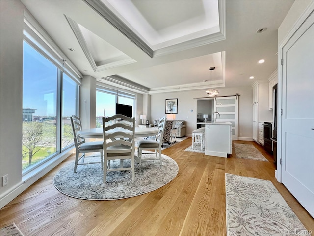 201 Beers St Unit 44, Port Huron, MI 48060 - dining room with light wood finished floors, a tray ceiling, ornamental molding, baseboards, and recessed lighting