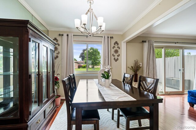 14850 La Grande Plz, Warren, MI 48088 - dining room with a chandelier, wood finished floors, and ornamental molding