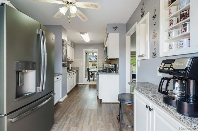 14850 La Grande Plz, Warren, MI 48088 - kitchen featuring appliances with stainless steel finishes, white cabinets, tasteful backsplash, a ceiling fan, and dark wood-style floors