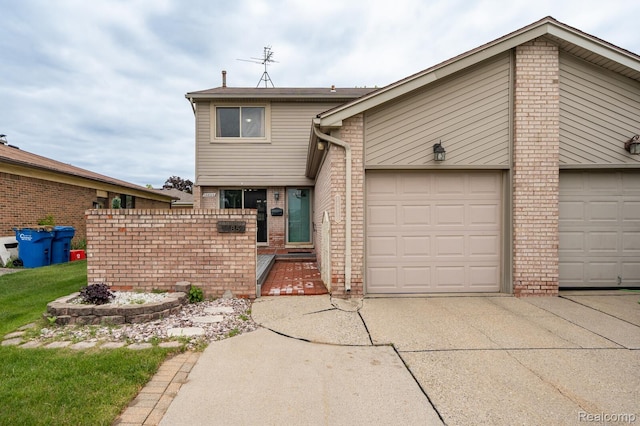 14850 La Grande Plz, Warren, MI 48088 - view of front of home with brick siding, driveway, and a garage