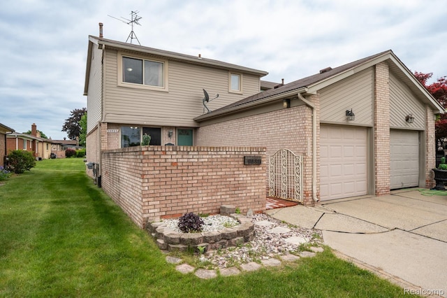 14850 La Grande Plz, Warren, MI 48088 - back of house with brick siding, a garage, driveway, and a lawn
