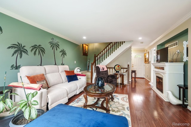 14850 La Grande Plz, Warren, MI 48088 - living room with crown molding, wood finished floors, stairway, recessed lighting, and a glass covered fireplace