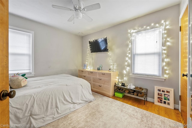 1950 Byrd St, Dearborn, MI 48124 - bedroom with wood finished floors, baseboards, and a ceiling fan