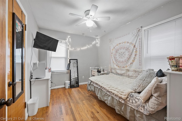 1950 Byrd St, Dearborn, MI 48124 - bedroom with light wood finished floors, baseboards, and a ceiling fan