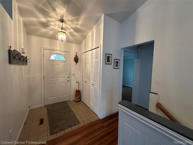 638 Eastway Cir, Lapeer, MI 48446 - entryway featuring dark wood-style flooring and baseboards