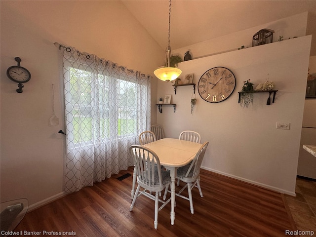638 Eastway Cir, Lapeer, MI 48446 - dining space with wood finished floors, lofted ceiling, and baseboards