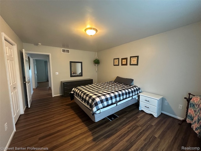 638 Eastway Cir, Lapeer, MI 48446 - bedroom featuring baseboards and dark wood finished floors