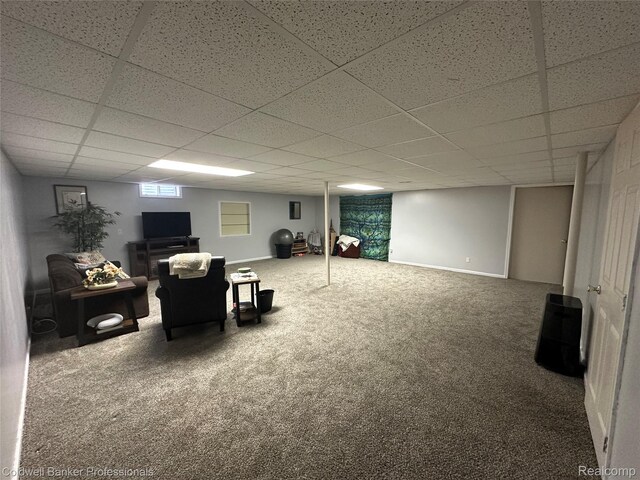 638 Eastway Cir, Lapeer, MI 48446 - below grade area featuring carpet floors, a paneled ceiling, and baseboards